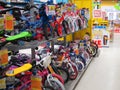 Rows of childrens bikes in a toy store.