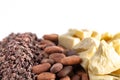 Rows of Chocolate Nibs Cocoa Beans and Cocoa Butter on a White Background Royalty Free Stock Photo