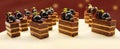 Fruit-Topped Chocolate Pastries Arrangement Royalty Free Stock Photo