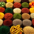 Rows of circular containers display an array of colorful spices, seeds, and dried