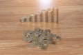 Rows of coin stacks on wooden floor. banking concept. Royalty Free Stock Photo