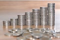 Rows of coin stacks on wooden floor. banking concept. Royalty Free Stock Photo