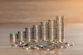 Rows of coin stacks on wooden floor. banking concept. Royalty Free Stock Photo