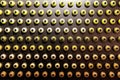 Rows of color paint spray cans placed on a black wall Royalty Free Stock Photo