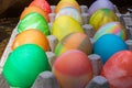 Rows of colored easter eggs in an egg carton Royalty Free Stock Photo