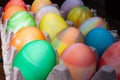 Rows of colored easter eggs in an egg carton Royalty Free Stock Photo