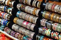 Rows of colorful bracelets on jewelry market Royalty Free Stock Photo