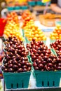 Rows of Colorful Cherries at Farmer`s Market