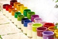 Rows with colorful glazed ceramic jars, flower pots, vases for s Royalty Free Stock Photo