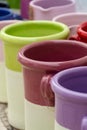 Rows with colorful glazed ceramic jars, flower pots, vases for s Royalty Free Stock Photo