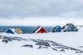 Rows of colorful inuit houses among rocks in a suburb of arctic Royalty Free Stock Photo