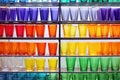 rows of colorful pyrex glassware on factory shelves