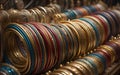 Rows of colourful metalic bangles displayed in a shop