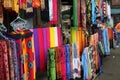 Rows of colourful silk scarfs hanging at a market stall in Indonesia Royalty Free Stock Photo