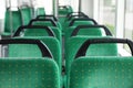 Rows of comfortable green seats in public transport