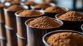 Rows of containers filled with dark brown powder Royalty Free Stock Photo