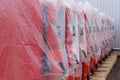 Rows of covered boilers awaiting installation in a manufacturing facility Royalty Free Stock Photo