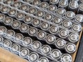 Rows of cylindrical batteries on a table Royalty Free Stock Photo