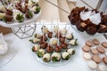 Rows of delicious desserts in beautiful compositions. Sweets on the banquet table - a photo taken during catering