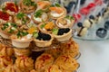 Rows of delicious desserts in beautiful compositions. Sweets on the banquet table - a photo taken during catering