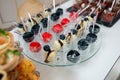 Rows of delicious desserts in beautiful compositions. Sweets on the banquet table - a photo taken during catering