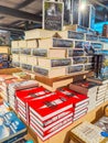 Rows of different colorful books lying on the shelves in the modern bookshop Royalty Free Stock Photo