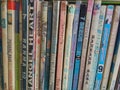 Rows of different colorful books lying on the shelves