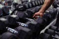 Rows of dumbbells in the gym with hand