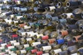 Rows of Dusty Empty Wine Bottles in a Dark Cellar or Warehouse Royalty Free Stock Photo