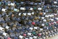 Rows of Dusty Empty Wine Bottles in a Dark Cellar or Warehouse Royalty Free Stock Photo