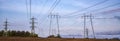 Rows of electrical towers and power lines.