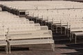 Rows of Empty Audience benches with Center Aisle, Right