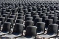 Rows of empty black plastic seats