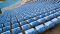 Rows of empty blue seats with numbers on the stadium Royalty Free Stock Photo