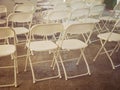 Rows of empty chair seats installed for outdoor party event Royalty Free Stock Photo