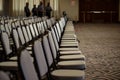 rows of empty chairs cordoned off, security personnel standing by Royalty Free Stock Photo