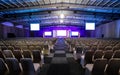 Rows of empty chairs in the large conference hall for corporate convention or lecture Royalty Free Stock Photo