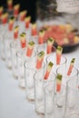 Rows of empty glasses and watermelon prepared for reception Royalty Free Stock Photo