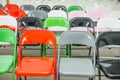 Rows of empty multicolor seats, chairs in auditorium, hall, classroom. Conference hall or seminar room. Selective focus.