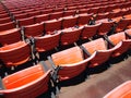 Rows of empty orange stadium seats Royalty Free Stock Photo