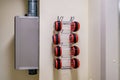 Rows of empty pneumatic tubes of transfer system station in modern clinic, designed for fast operational transfer of analyzes, Royalty Free Stock Photo