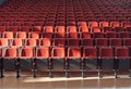 Rows of empty red chairs in a modern auditorium setting Royalty Free Stock Photo