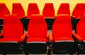 Rows of empty red seats or chairs in conference room Royalty Free Stock Photo