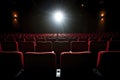 rows of empty theater seats under dim lighting Royalty Free Stock Photo