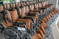 Rows empty wheelchairs parked at hospital