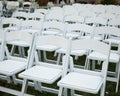 Rows of empty white chairs on a green lawn Royalty Free Stock Photo