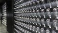 Rows of empty wine bottles in a vinotheque. Background. Copy space. .Mobile photo.Rows of empty wine bottles in a vinotheque. Royalty Free Stock Photo
