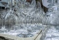 Rows of empty wine glasses close up. Glass goblets on the white table. Royalty Free Stock Photo