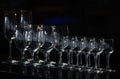 Rows of the empty wineglasses and empty glasses for vodka