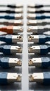 Rows of Ethernet cables arranged horizontally, featuring a single orange cable among Royalty Free Stock Photo